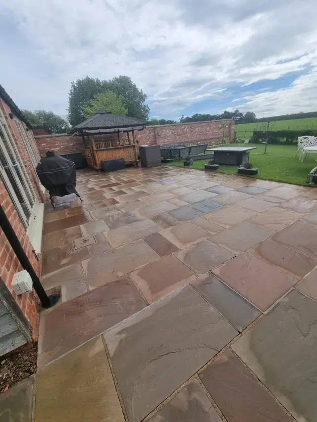 Sandstone patio after pressure washing by The Green Team